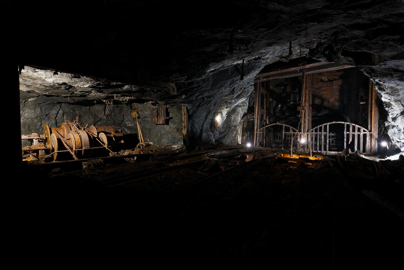 A large hoist sits next to the end of the shaft, to assist in mine operations.