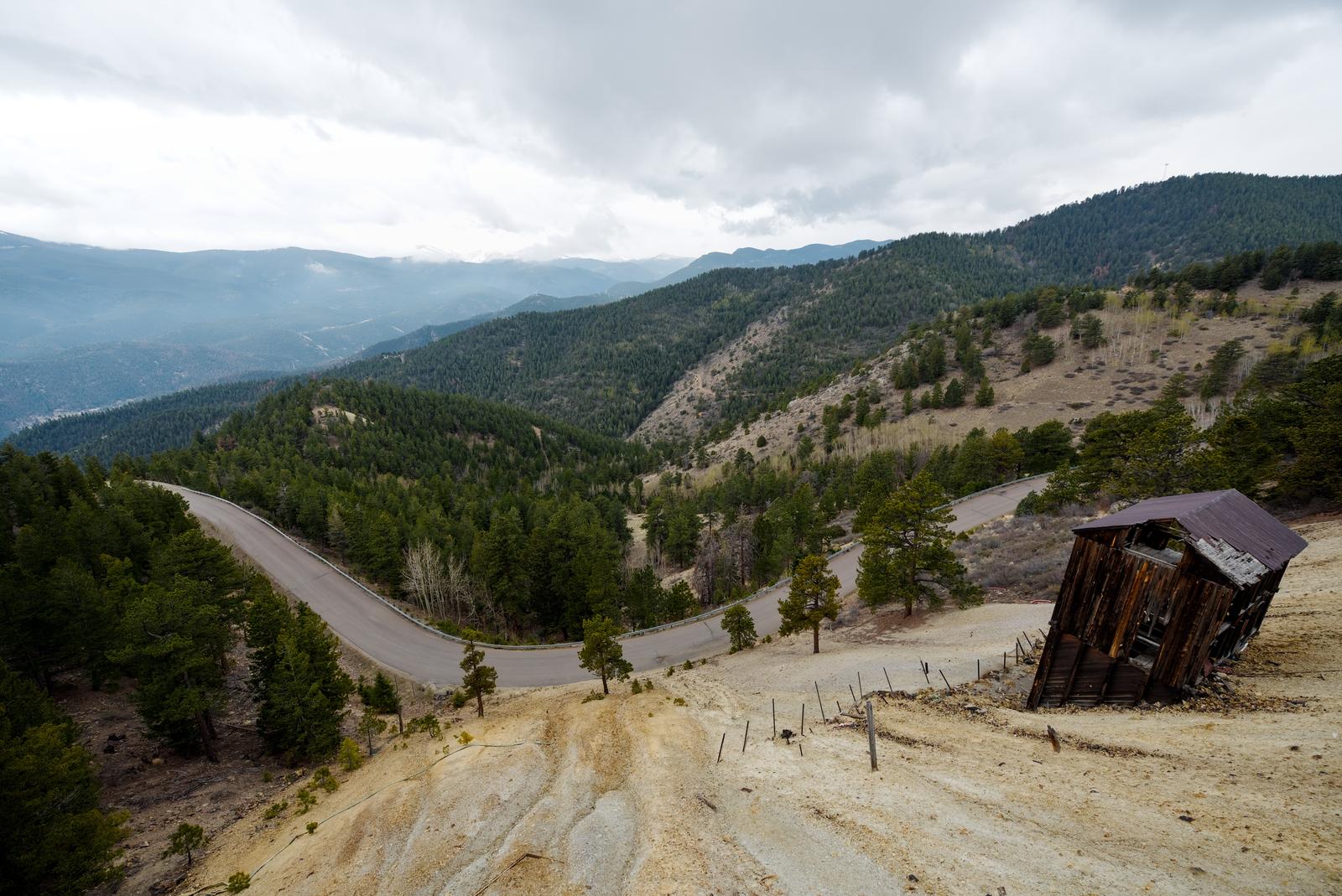 An old, abandoned mill sits perched precariously on a pile of mine tailings. It was snowing on and off and very cold!