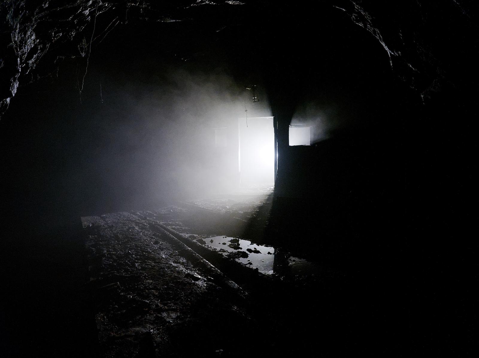 A smoky mine hospital lies abandoned.