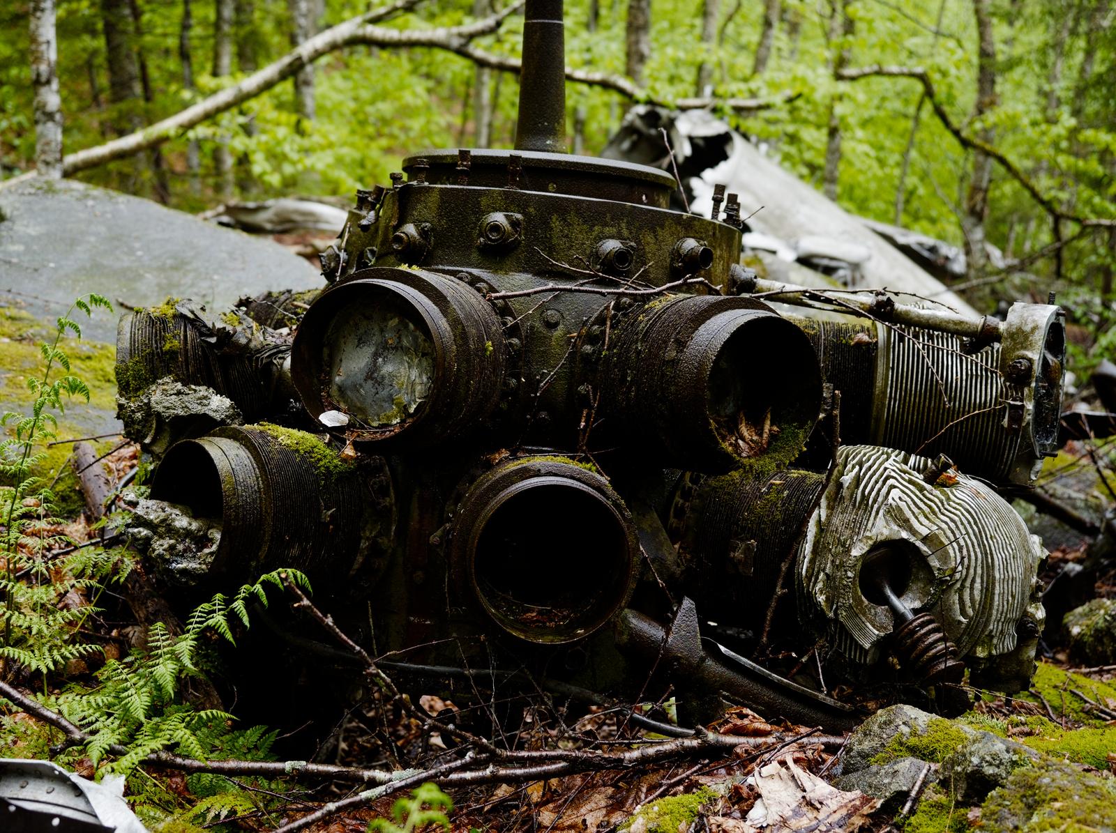 A Radial engine rests after a violent, deadly plane crash in the Catskills.