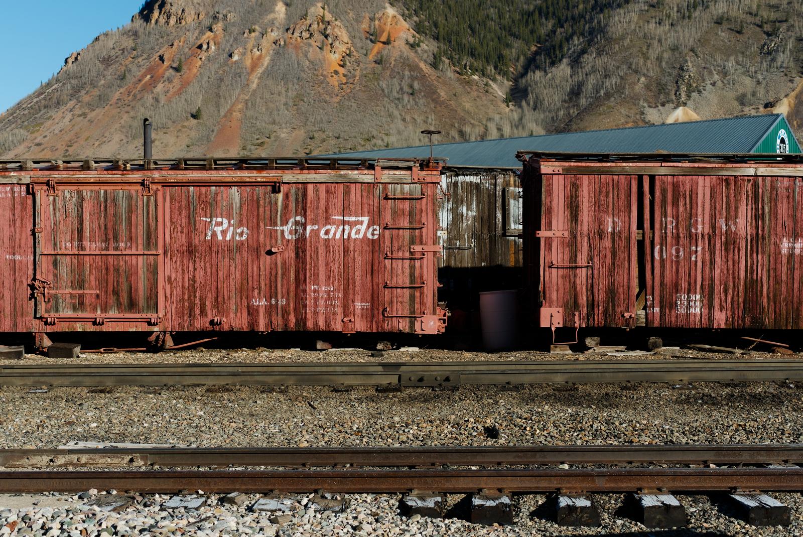 Old Rio Grande narrow gauge boxcars sit in Silverton, CO