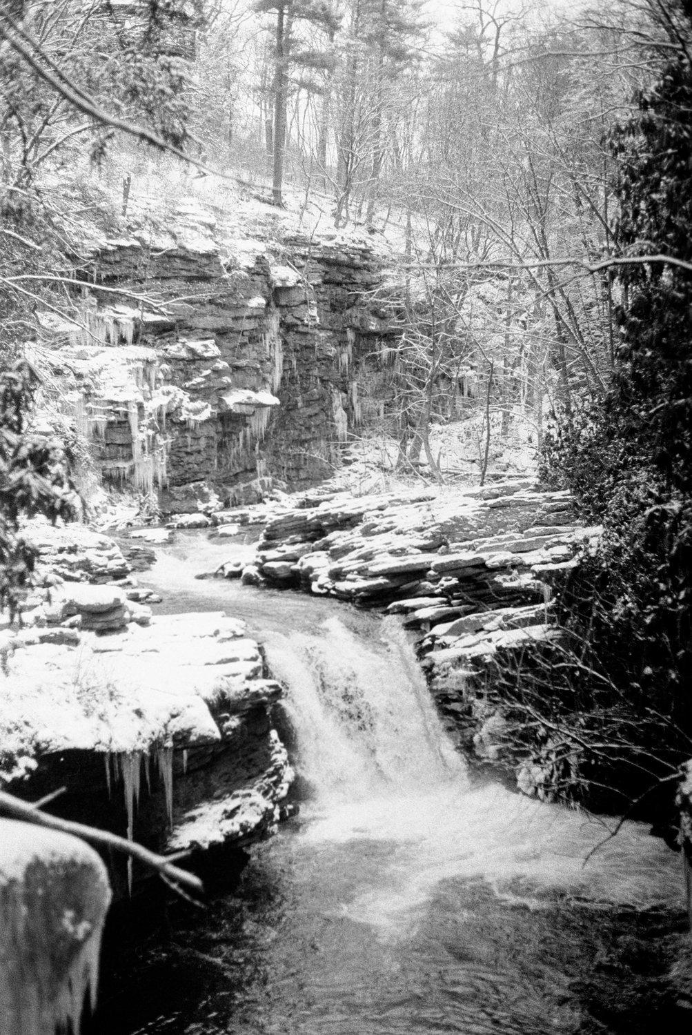 The timelessly beautiful Nay Aug gorge in Scranton, PA. This waterfall sees numerous deaths each year as teenage thrill-seekers underestimate the current and cliff jump into the gorge.

---

Shot on a Pentax ME Super + SMC 50mm f2; Kentmere PAN 400 + Rodinal 1+50.