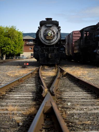 Canadian Pacific 2317 sits just at the start of the junction at Steamtown NHS. This locomotive was built in 1923 in Montreal and saw a rich life of mainline passenger service. Its revenue service ended in 1959, and after some time it ended up pulling passenger excursions. The last time it ran was in 2010.

https://en.wikipedia.org/wiki/Canadian_Pacific_2317