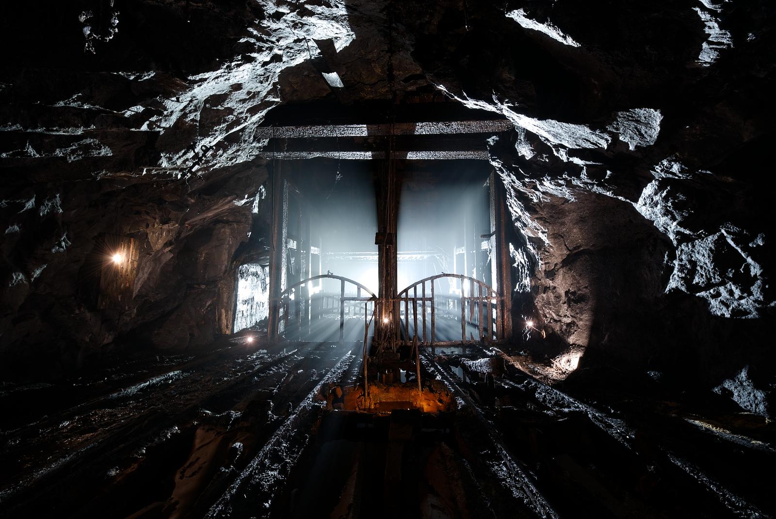 Deep in an abandoned mine, a mine shaft sits still as the groundwater trickles down. It really feels like a gate to hell when you are down there. This shaft was double-tracked to support carts moving in either direction.